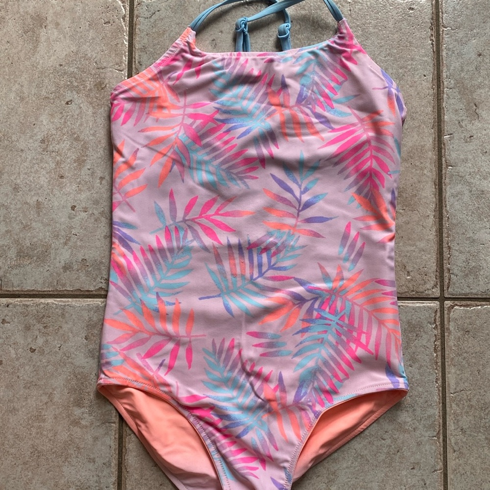 Justice girl’s size 12 one piece bathing suit, pink, purple, blue leaf design